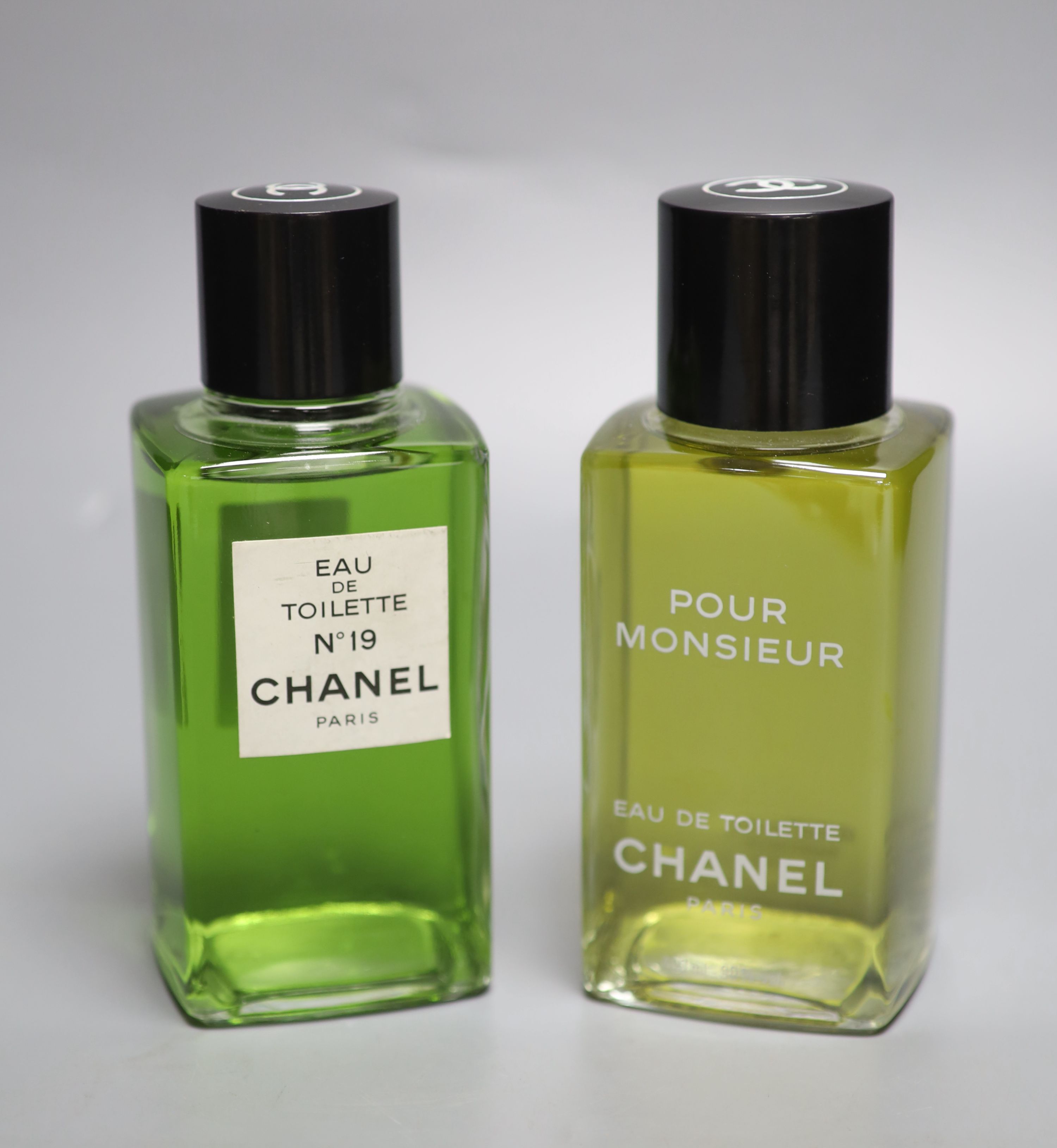 Two Chanel advertising perfume bottles, Pour Monsieur and Chanel No.19